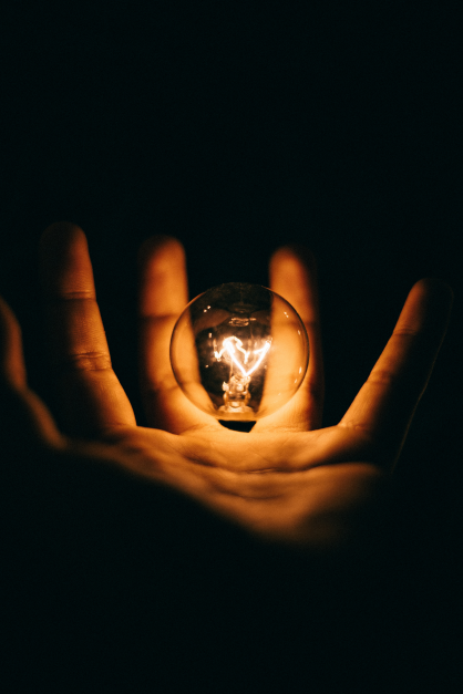 Image of lighbulb in hand by rohan makhecha via unsplash